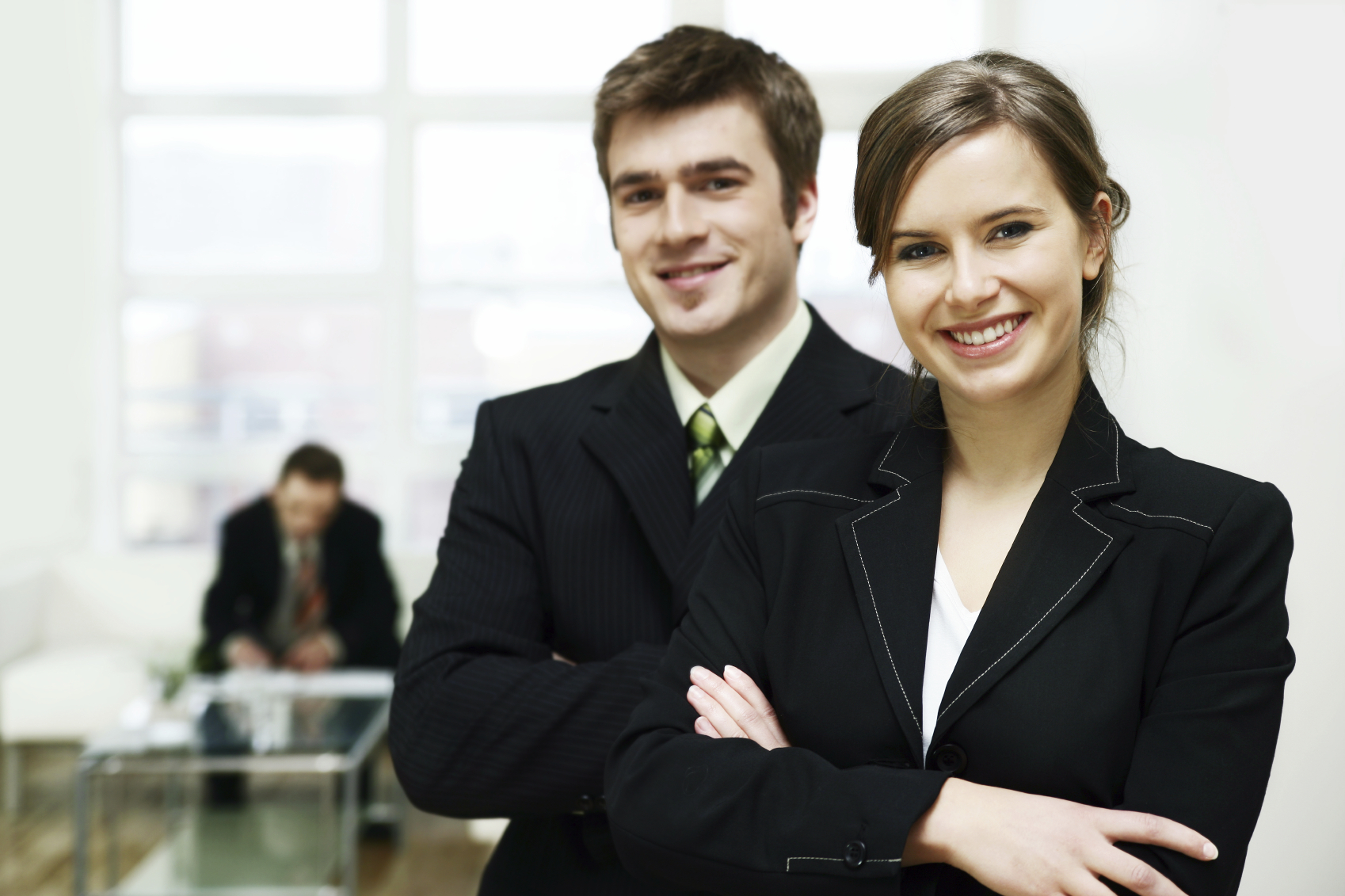 A woman and man in elegant clothes smiling