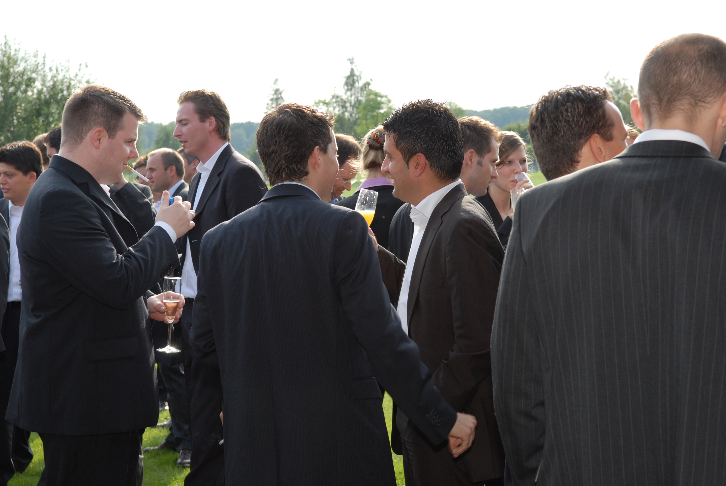 Men in suits talking to each other
