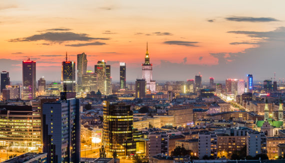 Buildings in Warsaw in the background of setting sun