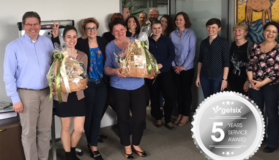 getsix® employees celebrating 5 years of service with gift baskets