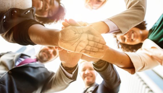 A group of people holding hands