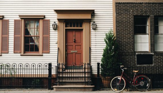 A bike in front of the houses