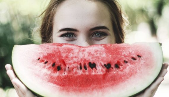 A woman with a watermelon