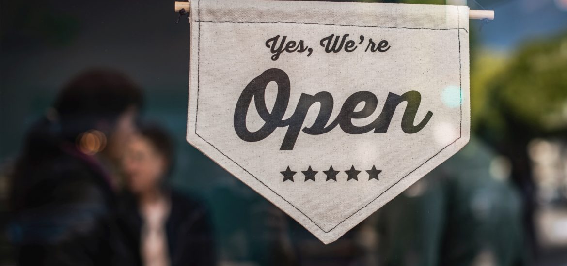 "Yes, we're open" sign