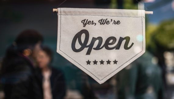 "Yes, we're open" sign