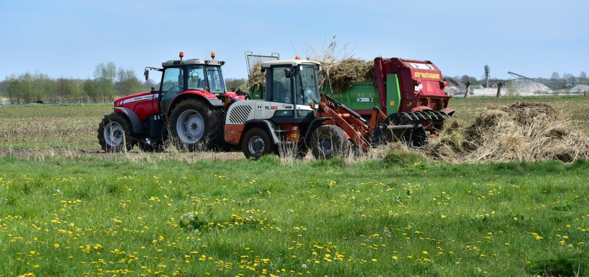 Netherlands agriculture industry nitrogen emissions crisis – farmer on tractor in Dutch fields