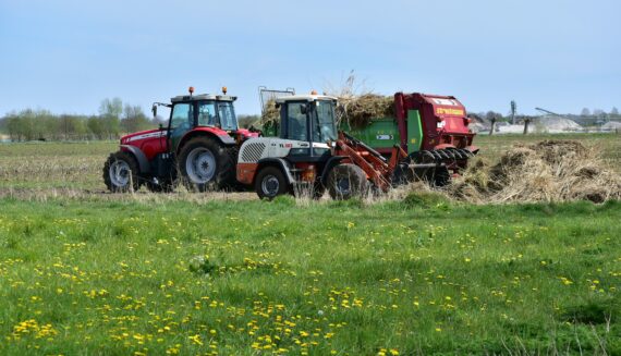 Netherlands agriculture industry nitrogen emissions crisis – farmer on tractor in Dutch fields