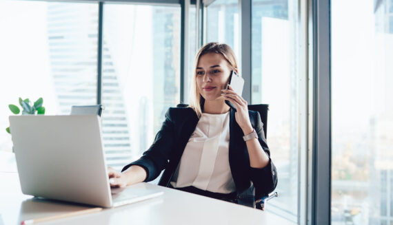 A woman talking on the phone in an office