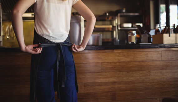 Woman tying her apron